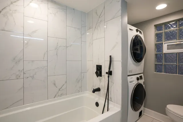 a bathroom with a sink a mirror and a bathtub