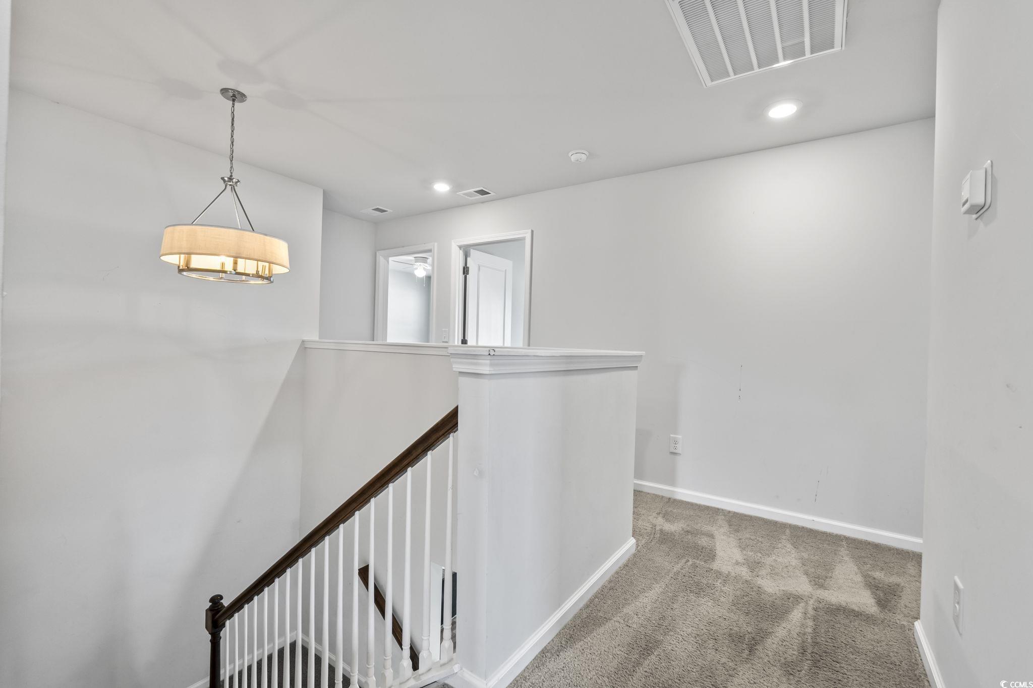 733 Lambeth Lane Conway, SC 29526 - Photo 23 of 40 Hall with carpet floors, an upstairs landing, and recessed lighting