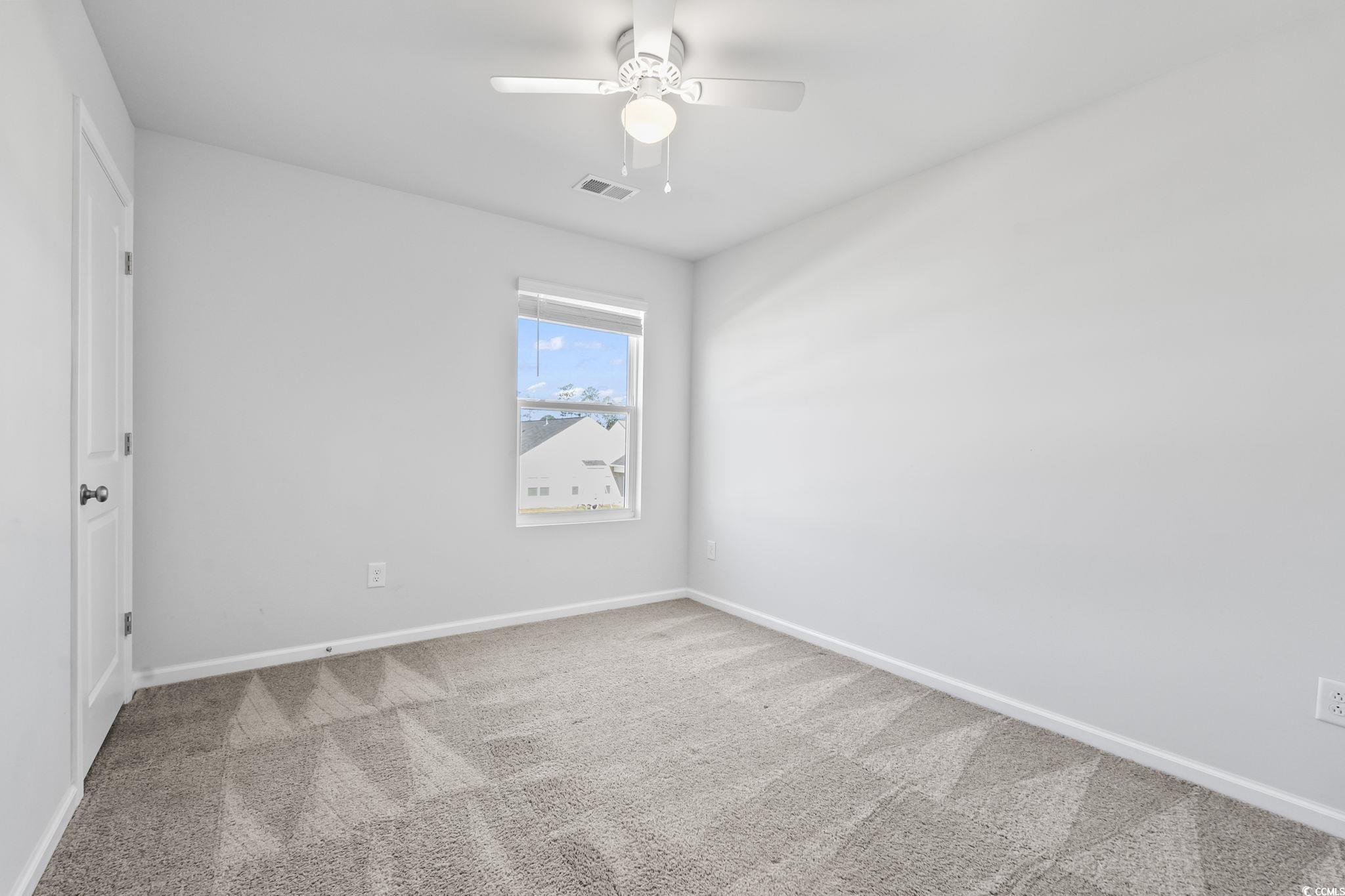 733 Lambeth Lane Conway, SC 29526 - Photo 27 of 40 Carpeted empty room with baseboards and ceiling fan