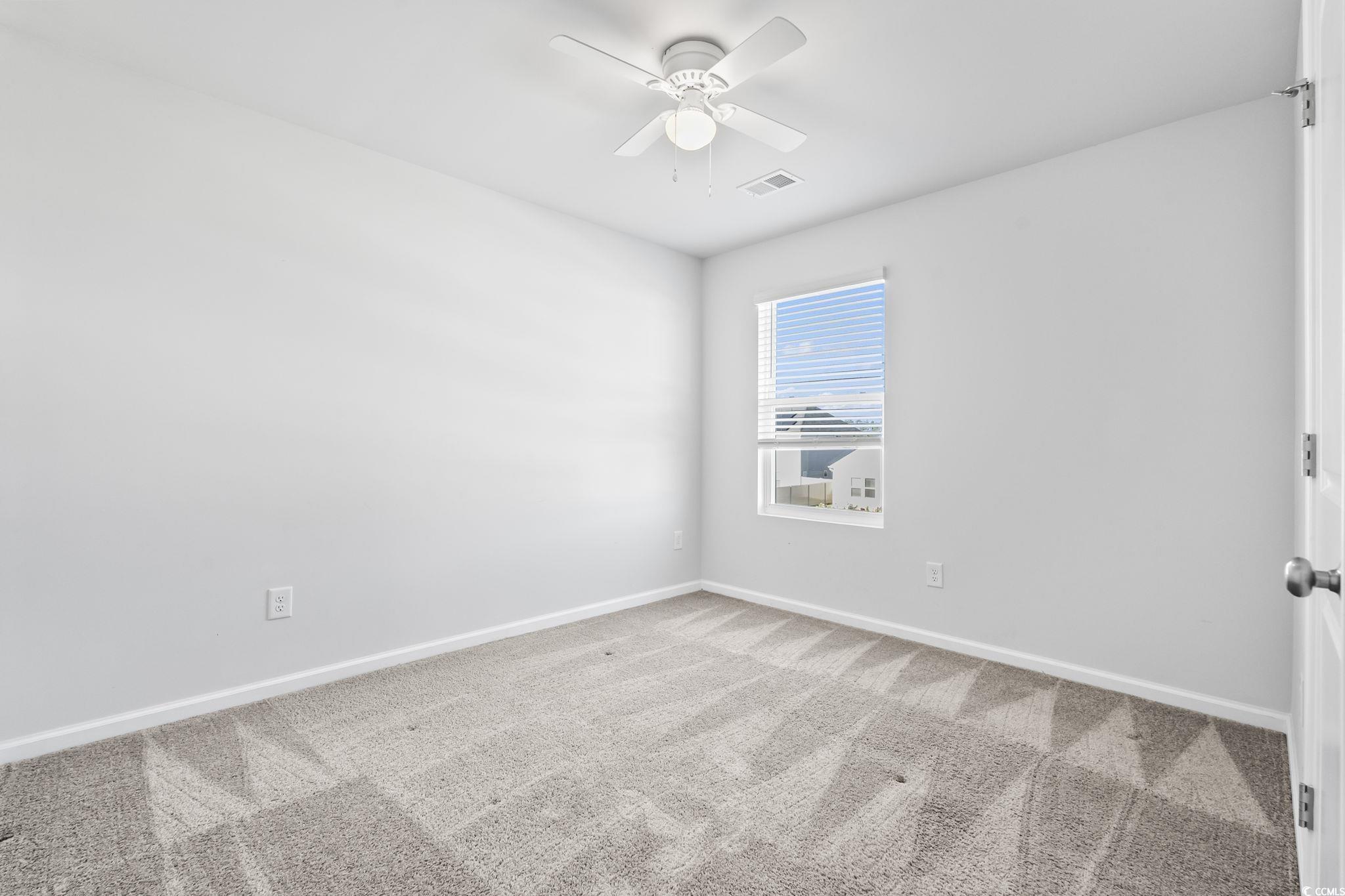 733 Lambeth Lane Conway, SC 29526 - Photo 28 of 40 Empty room with light carpet and ceiling fan