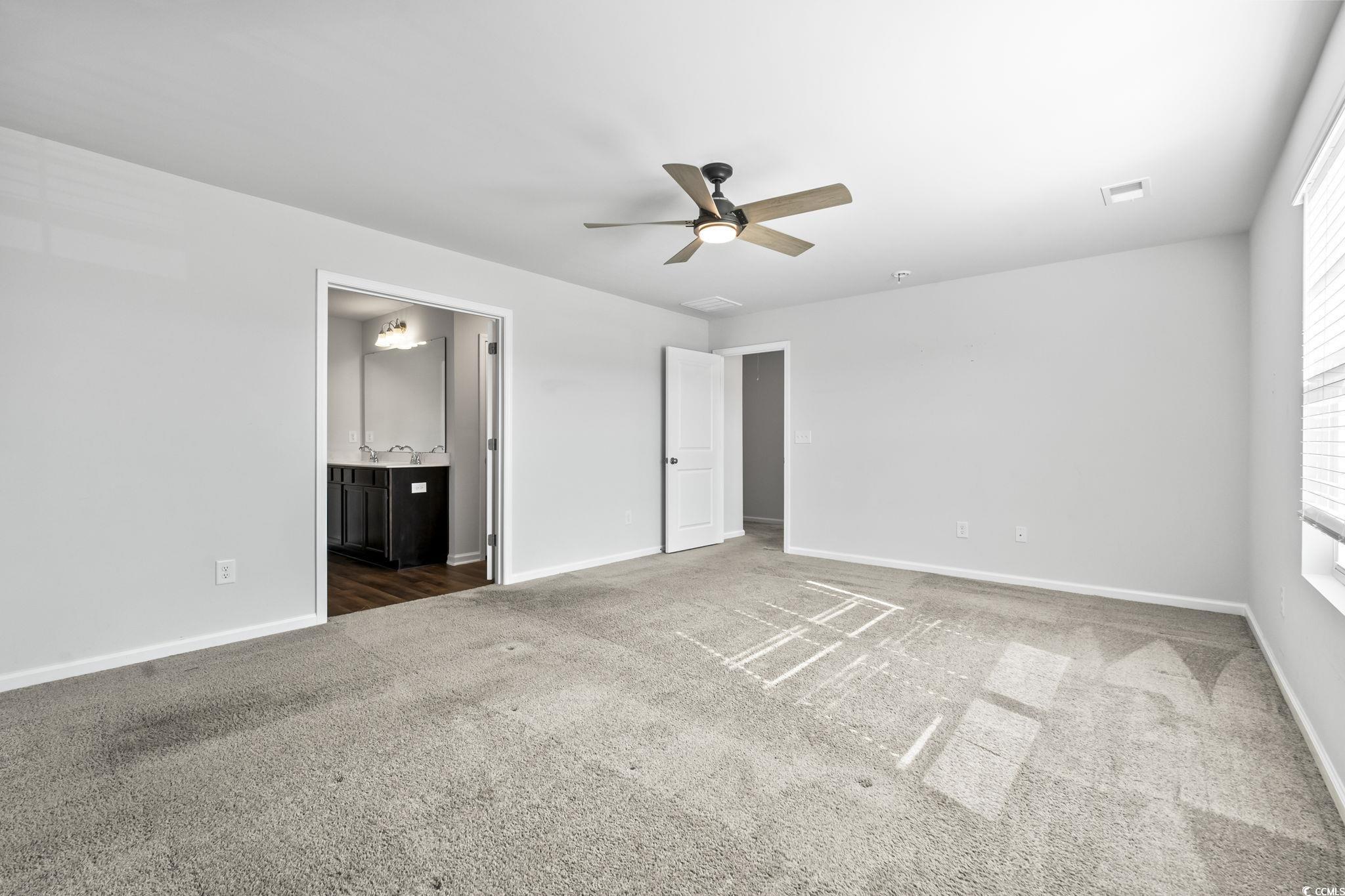 733 Lambeth Lane Conway, SC 29526 - Photo 32 of 40 Unfurnished bedroom featuring ensuite bathroom, carpet floors, and ceiling fan