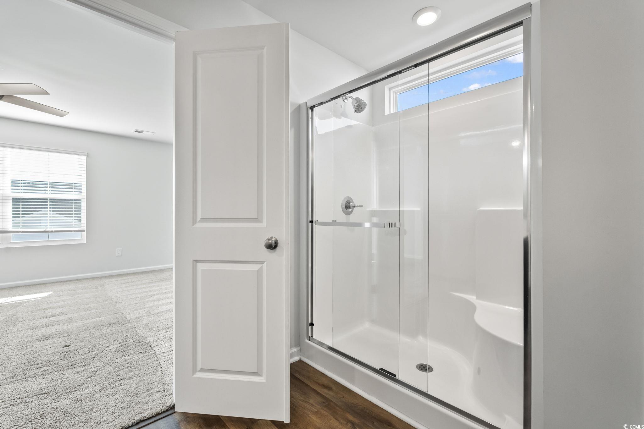 733 Lambeth Lane Conway, SC 29526 - Photo 33 of 40 Full bath featuring a stall shower and dark wood-style flooring