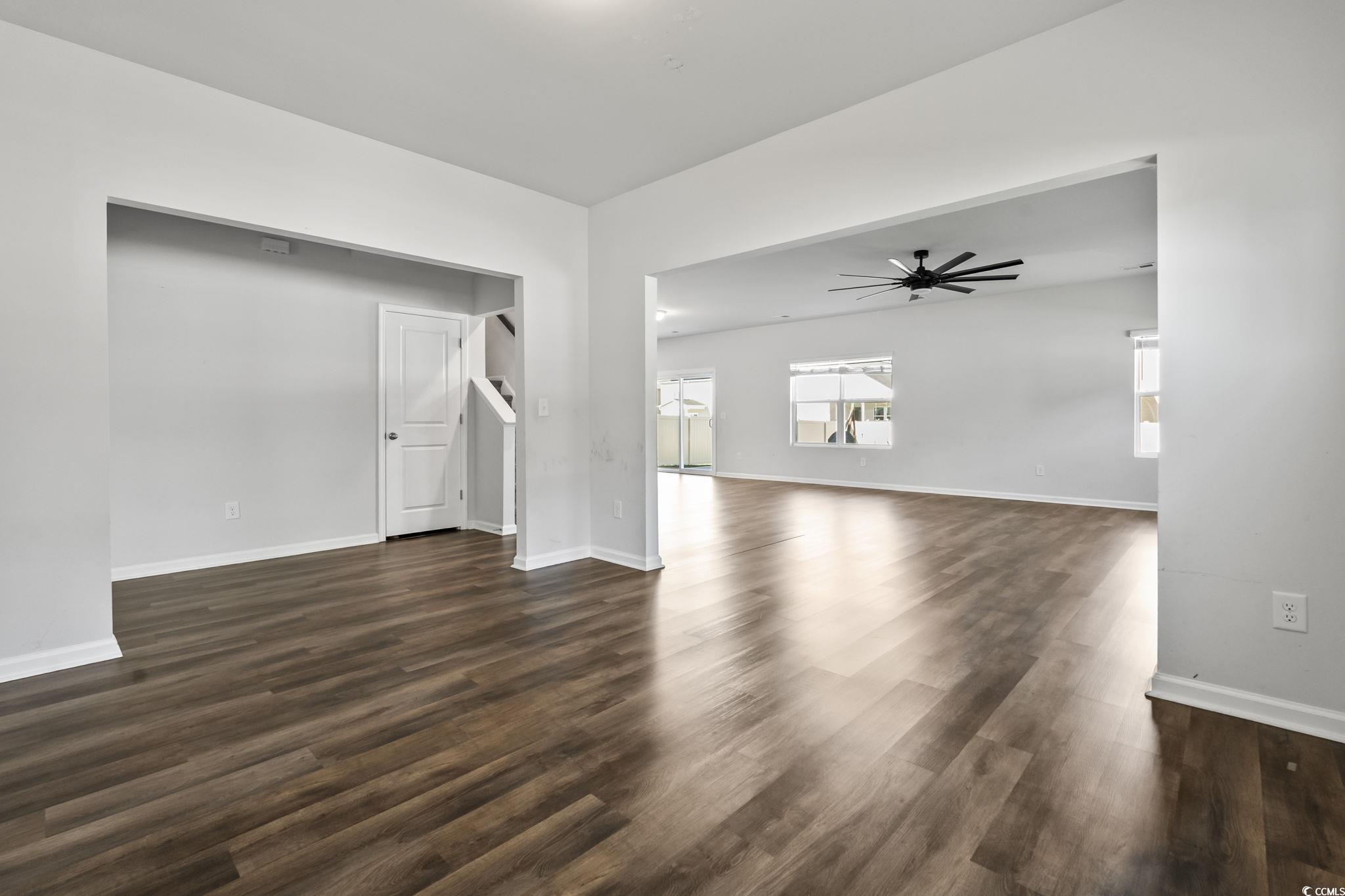 733 Lambeth Lane Conway, SC 29526 - Photo 6 of 40 Unfurnished room featuring dark wood-style flooring and a ceiling fan