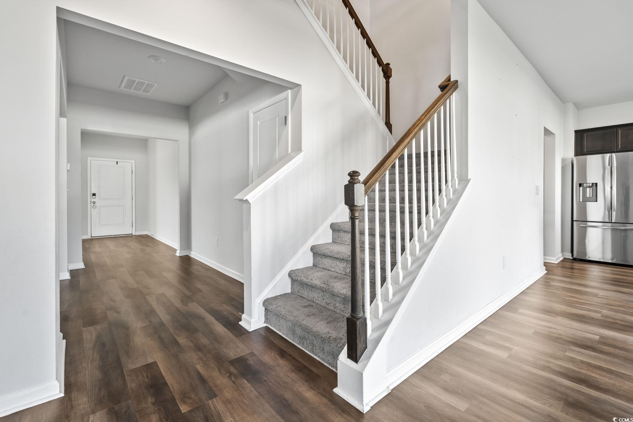 733 Lambeth Lane Conway, SC 29526 - Photo 7 of 40 Staircase featuring wood finished floors and baseboards