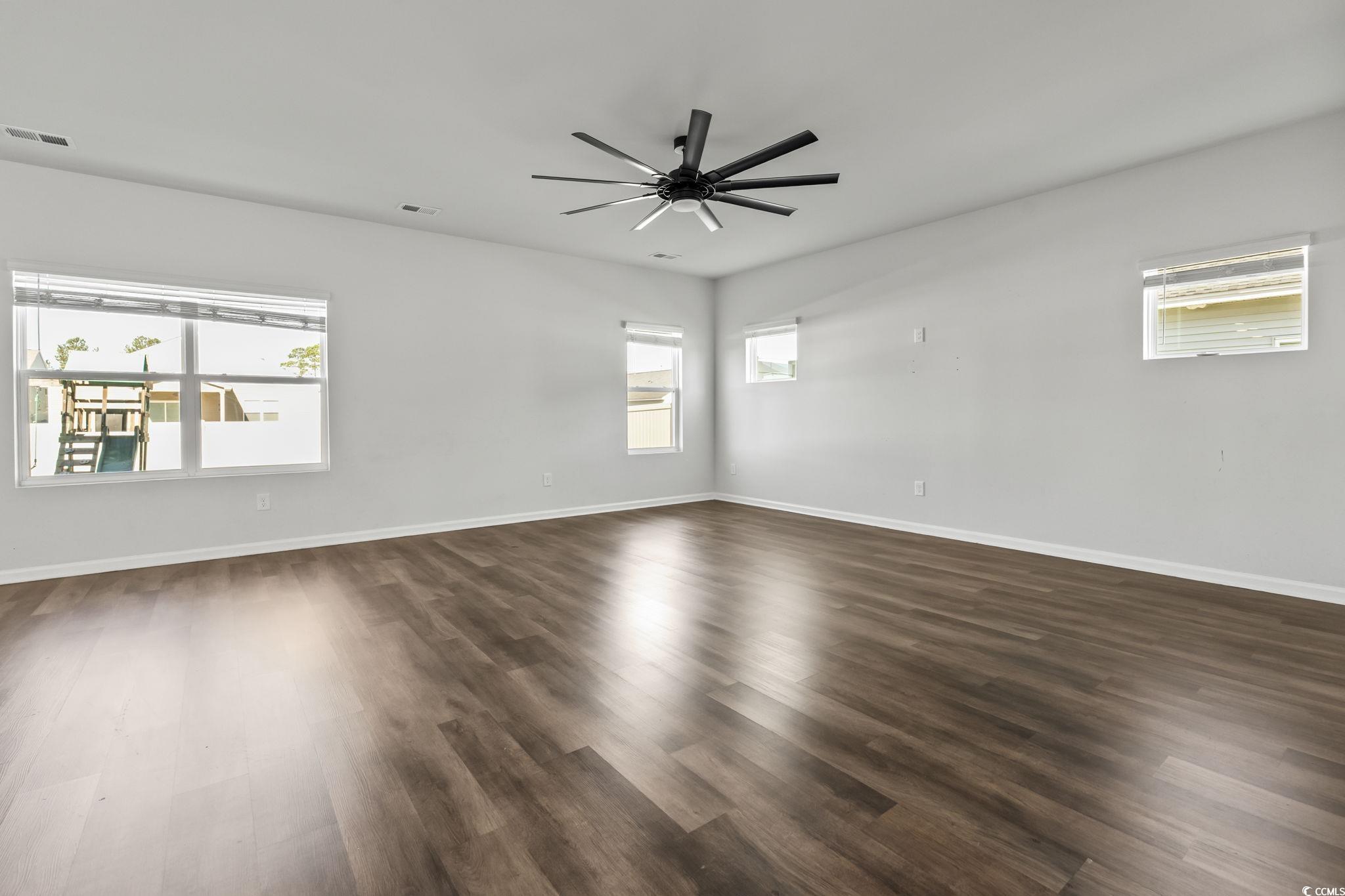 733 Lambeth Lane Conway, SC 29526 - Photo 8 of 40 Spare room featuring dark wood-style flooring and ceiling fan
