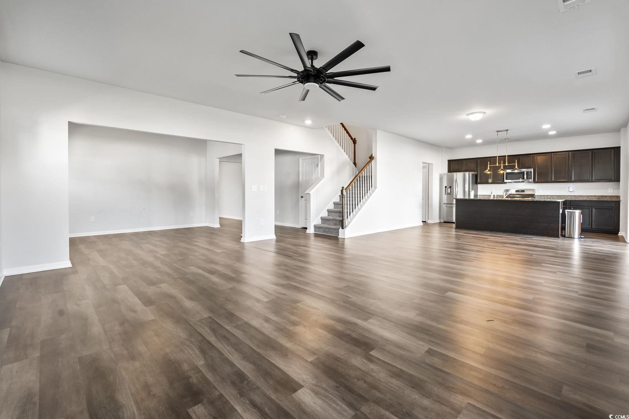 733 Lambeth Lane Conway, SC 29526 - Photo 10 of 40 Unfurnished living room with stairway, dark wood-style floors, ceiling fan, and recessed lighting