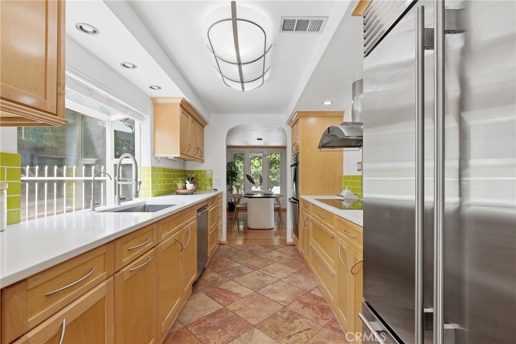 41 Hidden Valley Road Monrovia, CA 91016 - Photo 11 of 51 a large kitchen with a large window a refrigerator and a sink