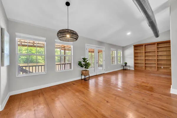 a view of dining room and hall with wooden floor