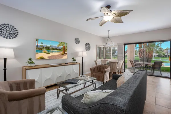 a living room with furniture and a large window