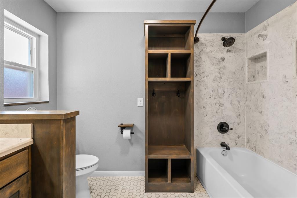373 Ingred Street Waco, TX 76705 - Photo 14 of 39 a bathroom with a bathtub toilet and a shower