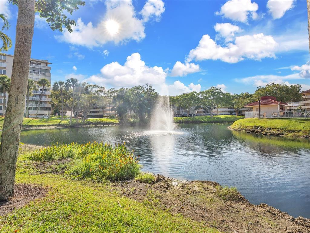 6901 Environ Boulevard, Unit 4D Lauderhill, FL 33319 - Photo 20 of 23 a view of a lake with a nearby beach
