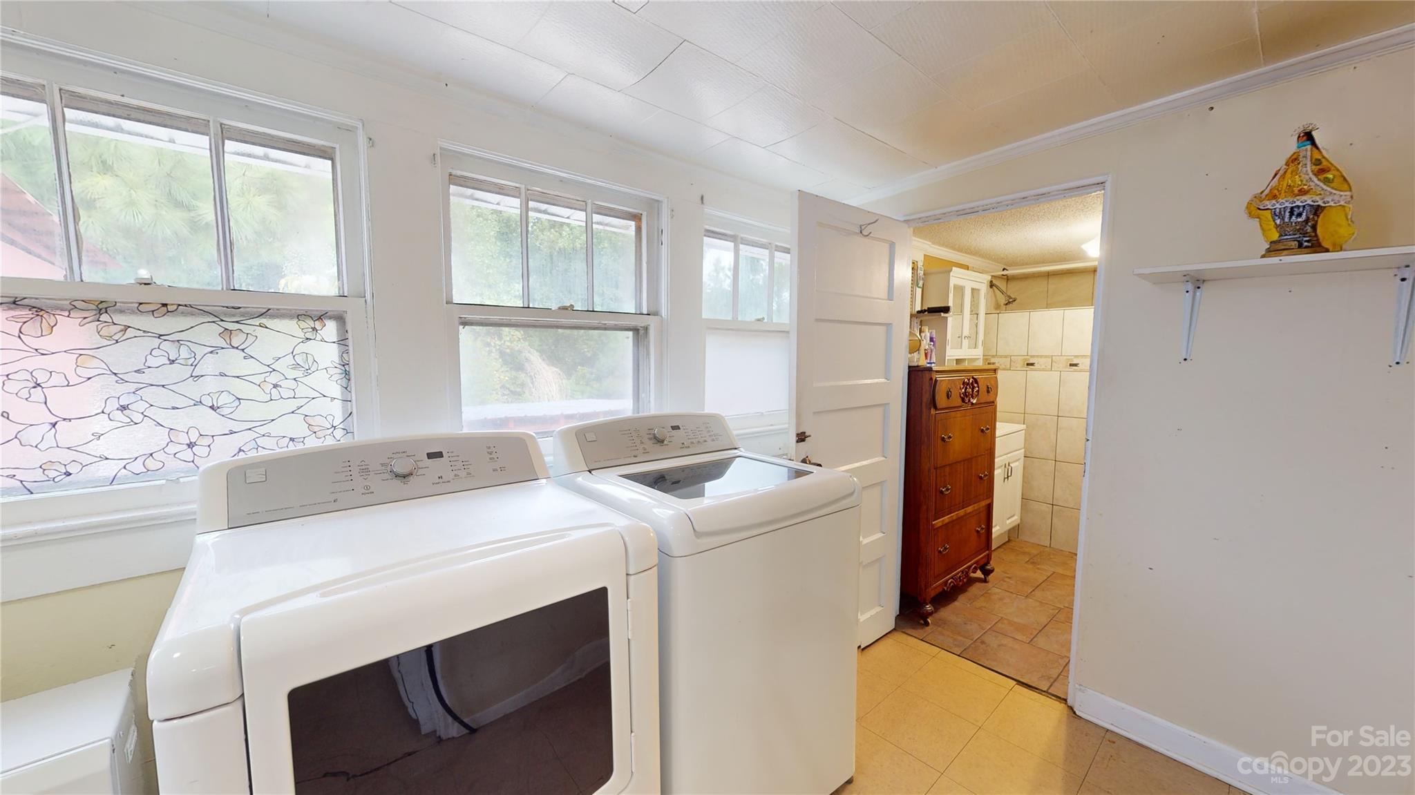 57 Lamar Street Marion, NC 28752 - Photo 11 of 48 a utility room with dryer and washer