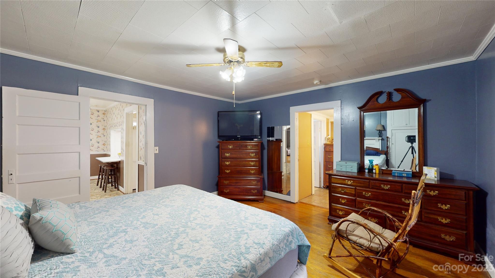 57 Lamar Street Marion, NC 28752 - Photo 16 of 48 a bedroom with a bed and wooden floor