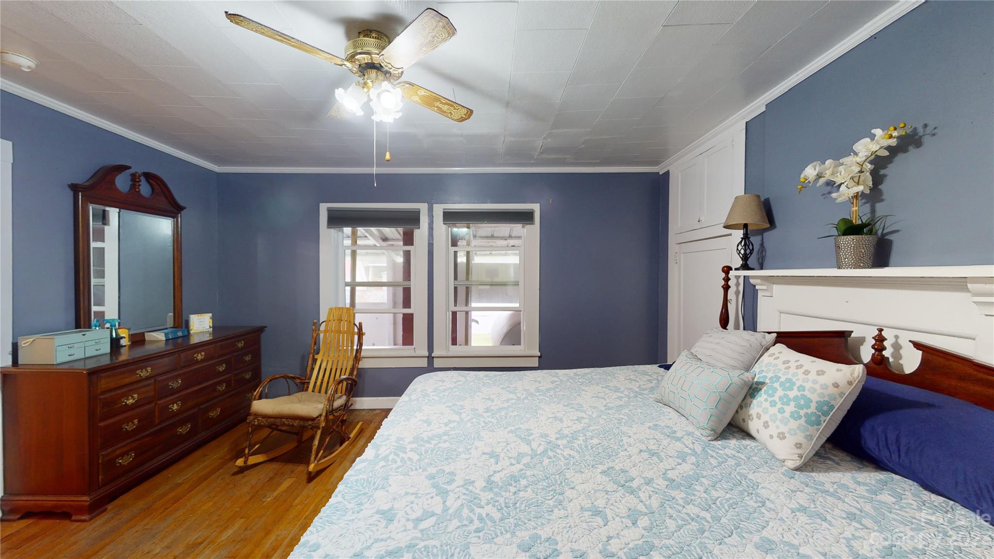 57 Lamar Street Marion, NC 28752 - Photo 17 of 48 a bedroom with a bed and a chandelier
