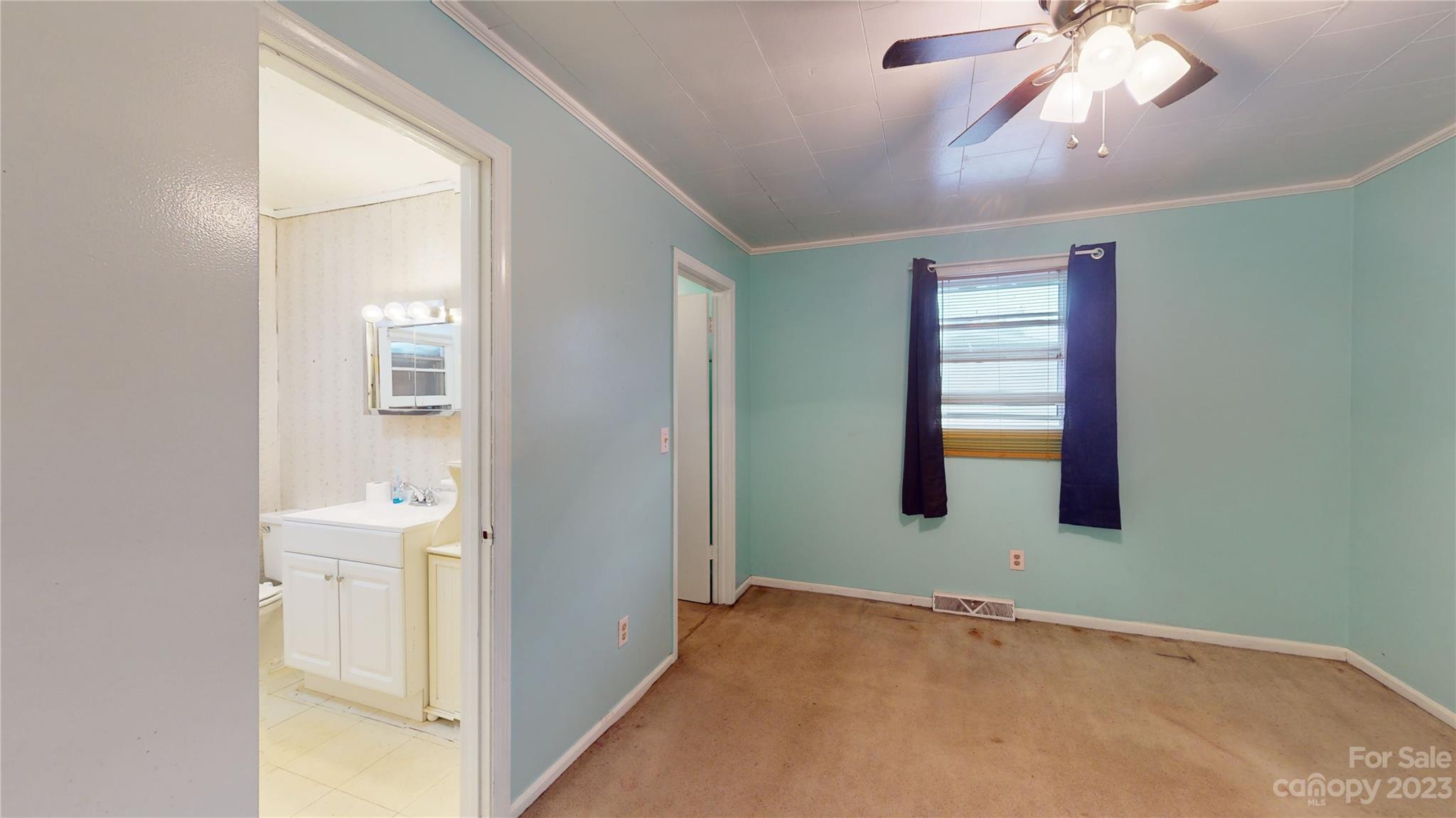 57 Lamar Street Marion, NC 28752 - Photo 20 of 48 a view of empty room with window