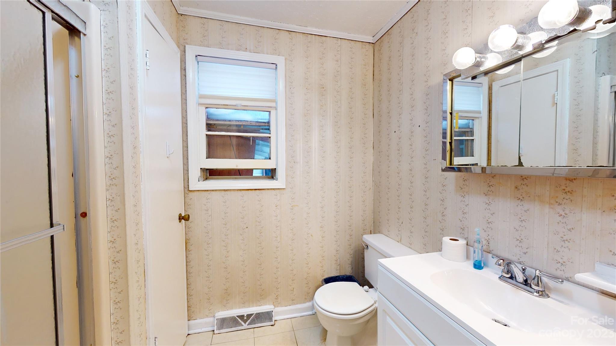 57 Lamar Street Marion, NC 28752 - Photo 22 of 48 a bathroom with a sink a toilet and shower