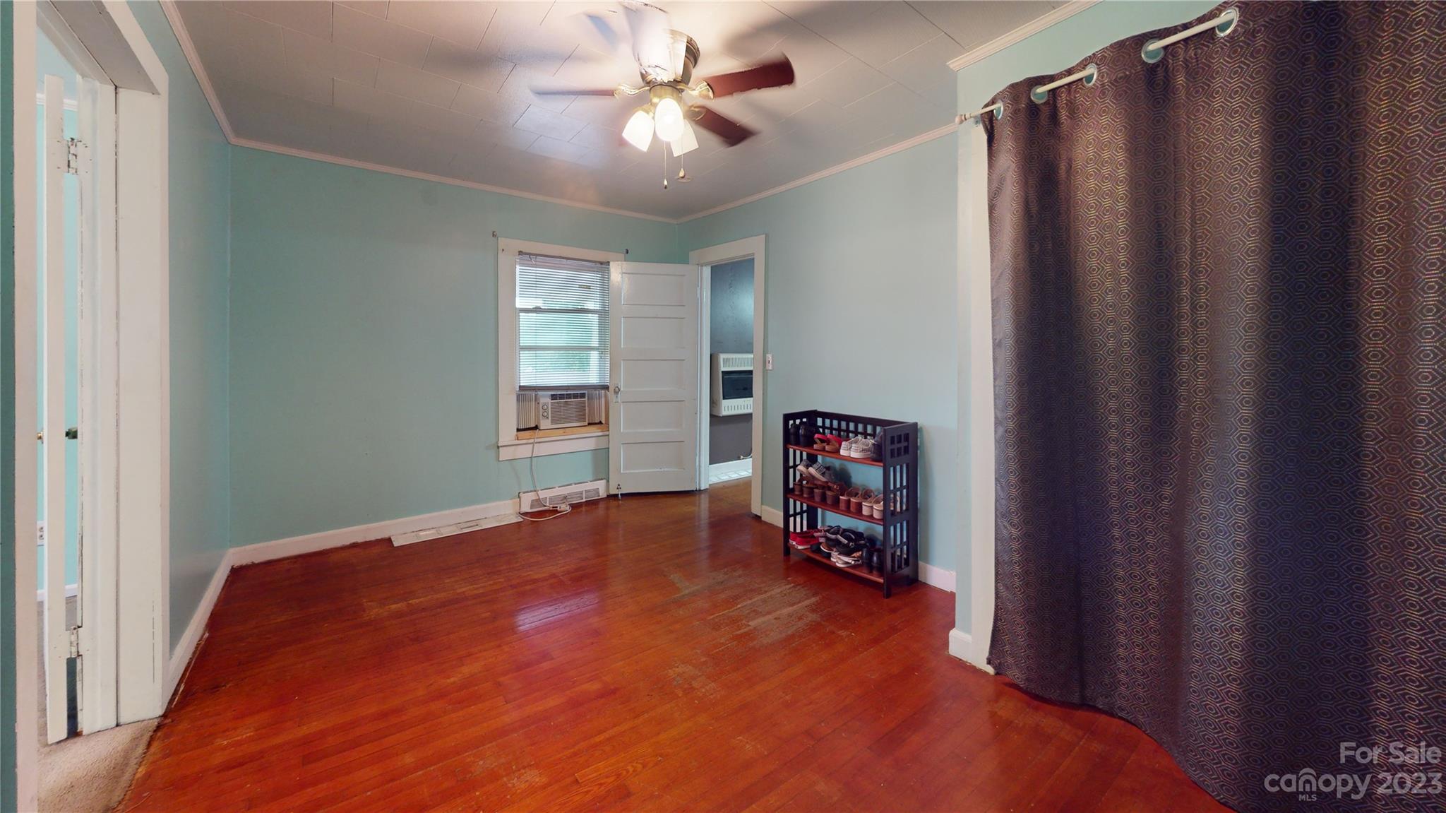 57 Lamar Street Marion, NC 28752 - Photo 27 of 48 a view of empty room with window and ceiling fan
