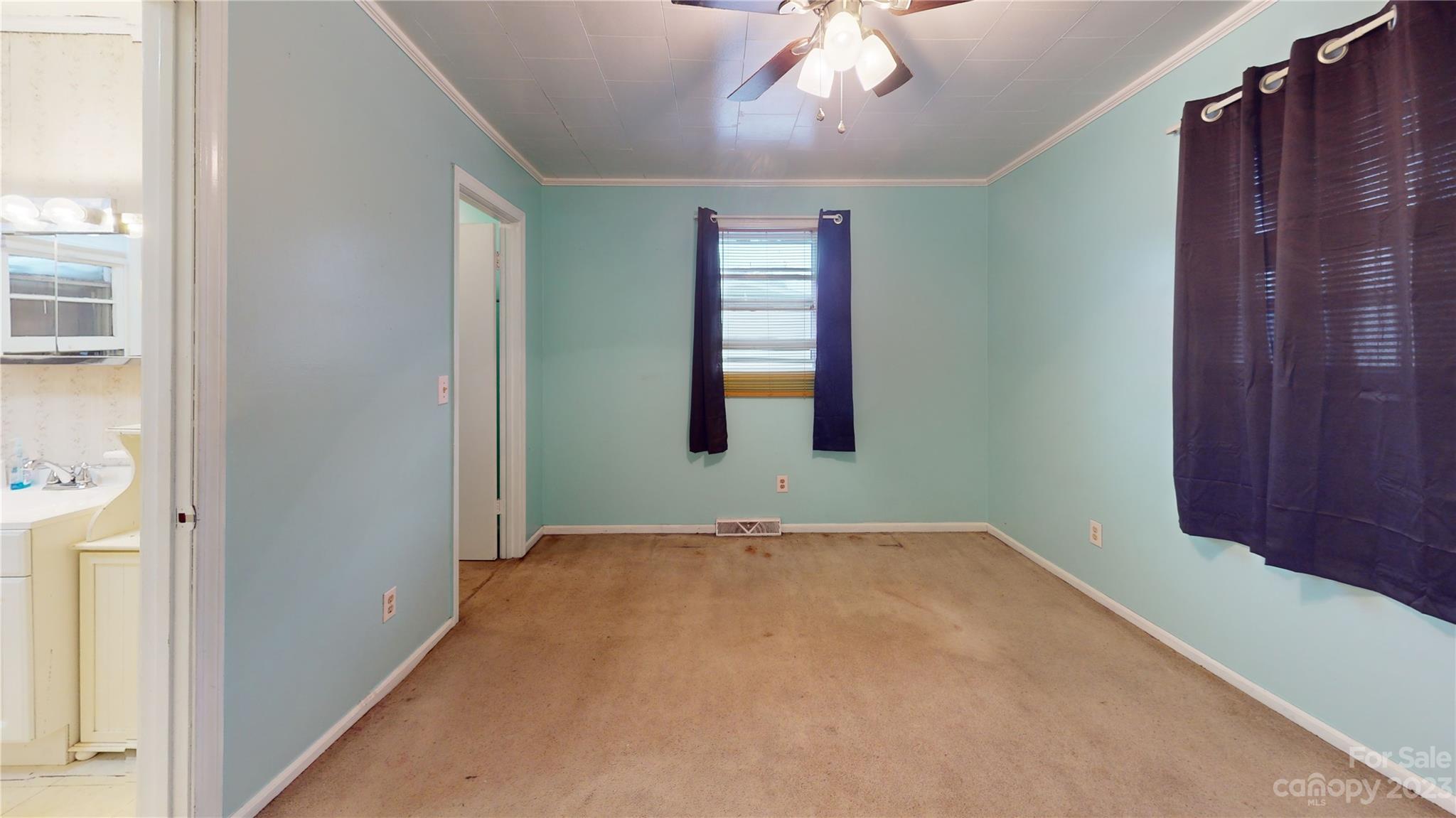 57 Lamar Street Marion, NC 28752 - Photo 30 of 48 a view of an empty room with a window