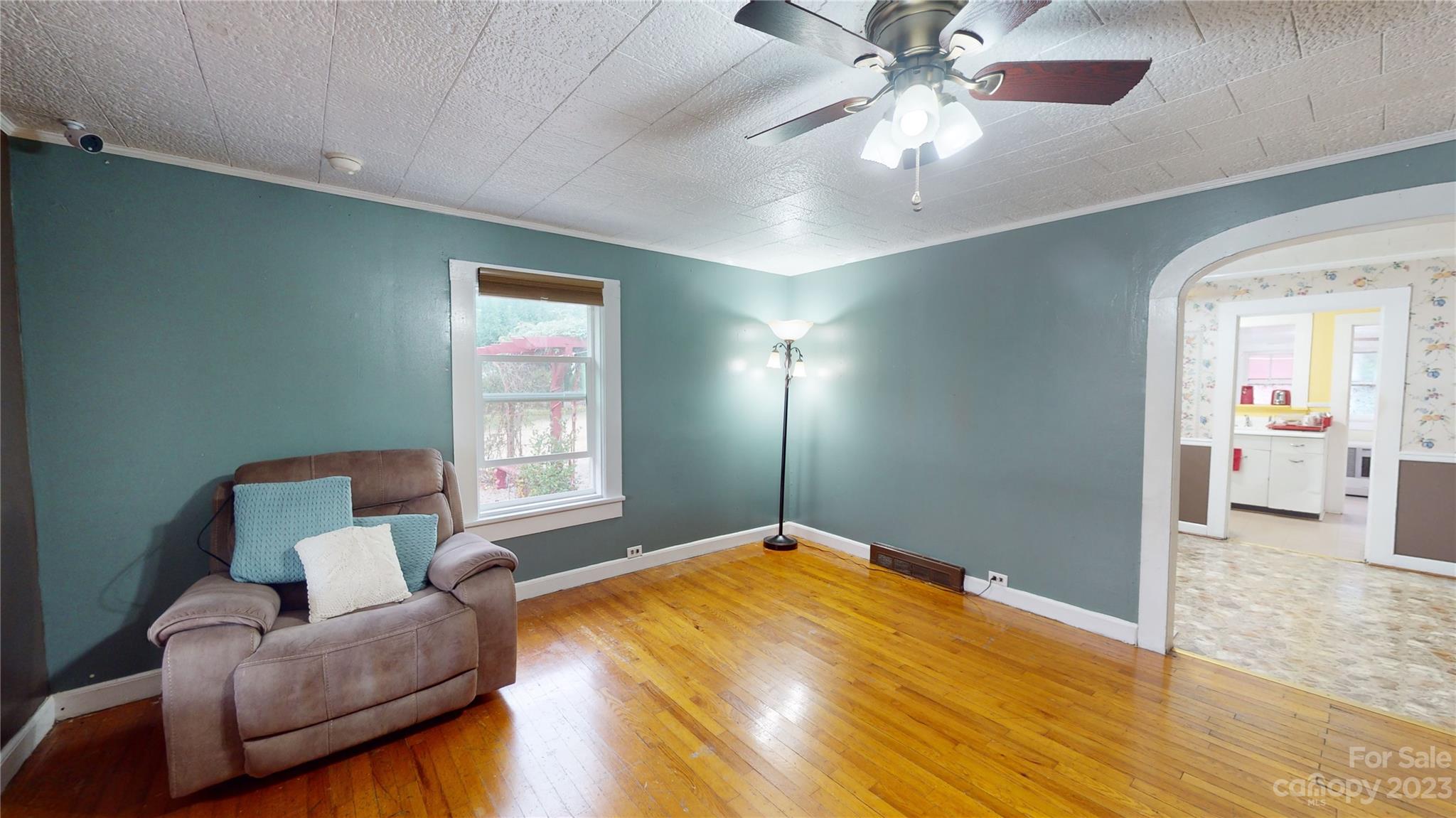 57 Lamar Street Marion, NC 28752 - Photo 3 of 48 a bedroom with a bed and ceiling fan