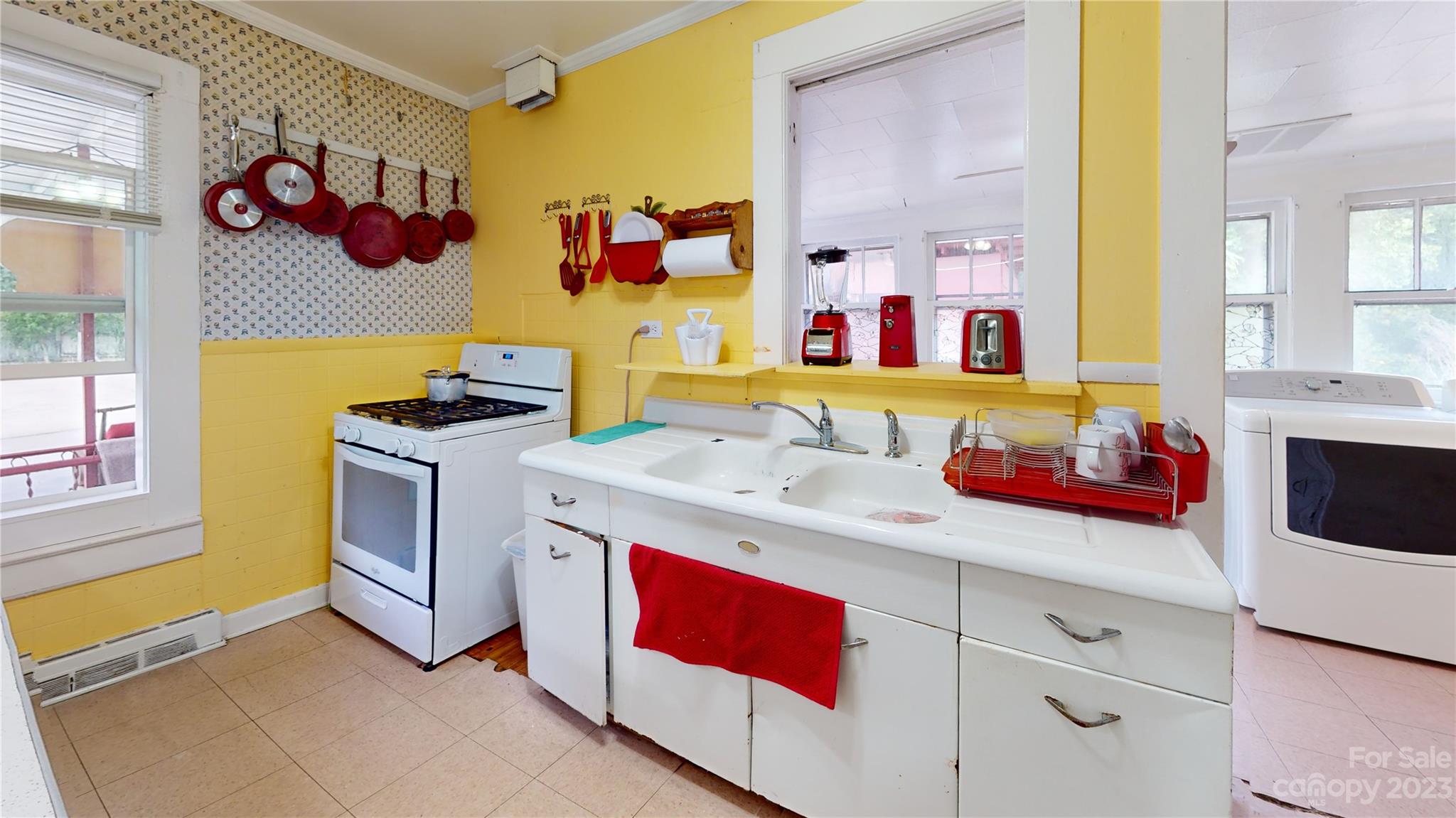 57 Lamar Street Marion, NC 28752 - Photo 31 of 48 a kitchen with a sink stove and cabinets