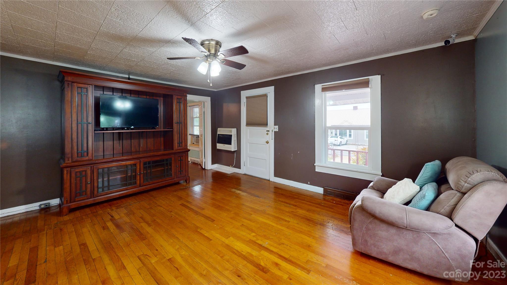 57 Lamar Street Marion, NC 28752 - Photo 33 of 48 a living room with furniture and a flat screen tv