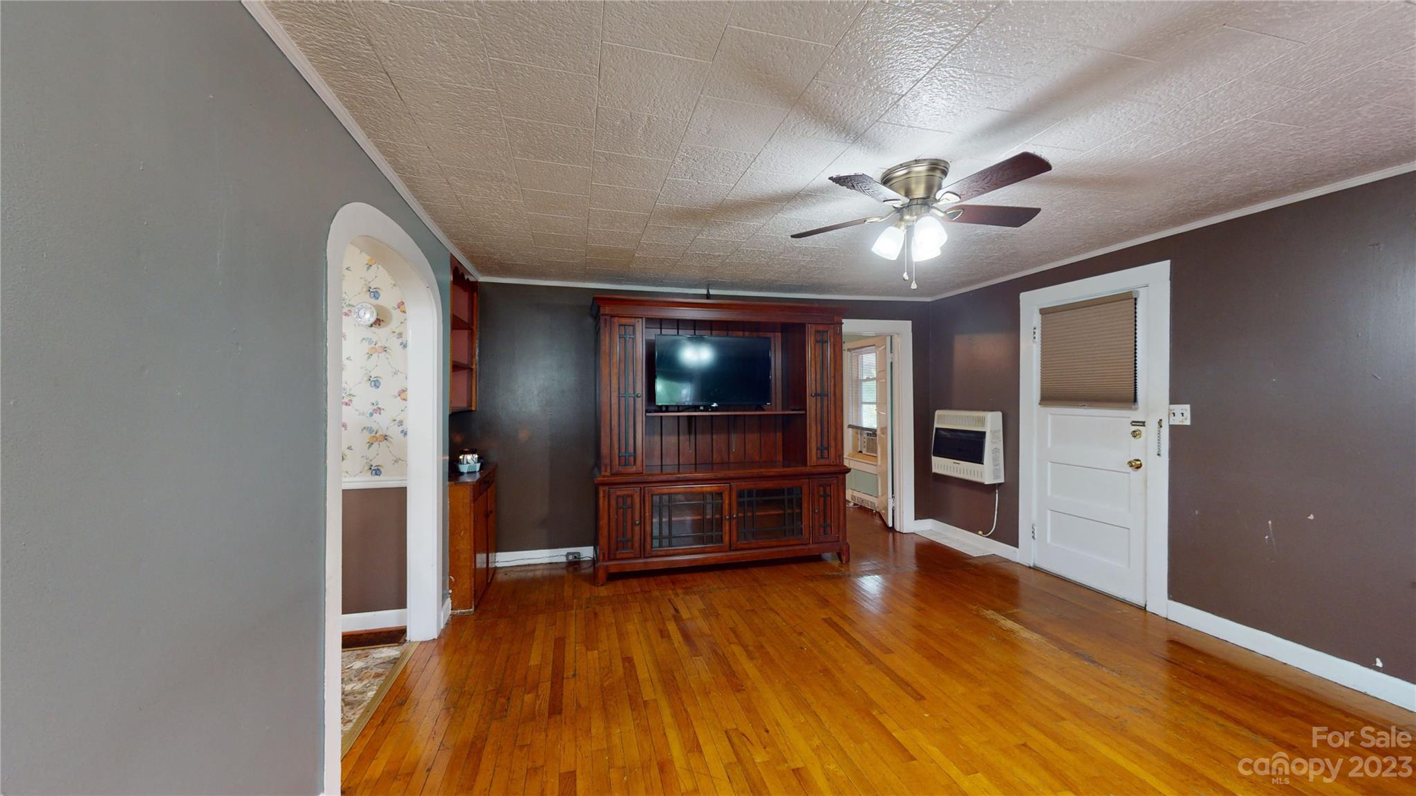 57 Lamar Street Marion, NC 28752 - Photo 4 of 48 wooden floor in an empty room with a window