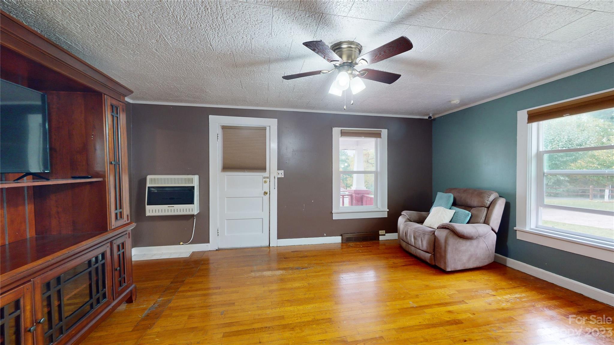 57 Lamar Street Marion, NC 28752 - Photo 5 of 48 a living room with furniture and a flat screen tv