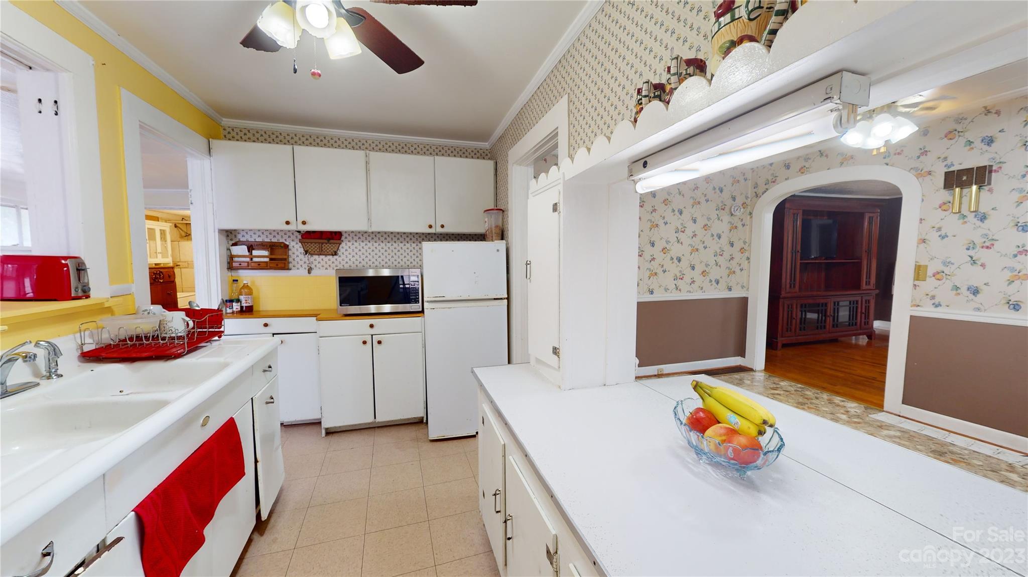 57 Lamar Street Marion, NC 28752 - Photo 10 of 48 a kitchen with stainless steel appliances granite countertop a sink stove and refrigerator