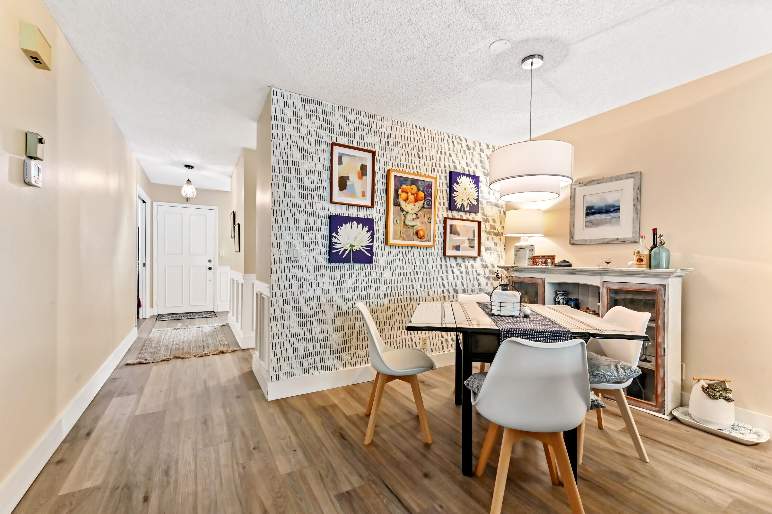 13960 Vía Flora, Unit H Delray Beach, FL 33484 - Photo 14 of 39 a dining room with furniture and wooden floor