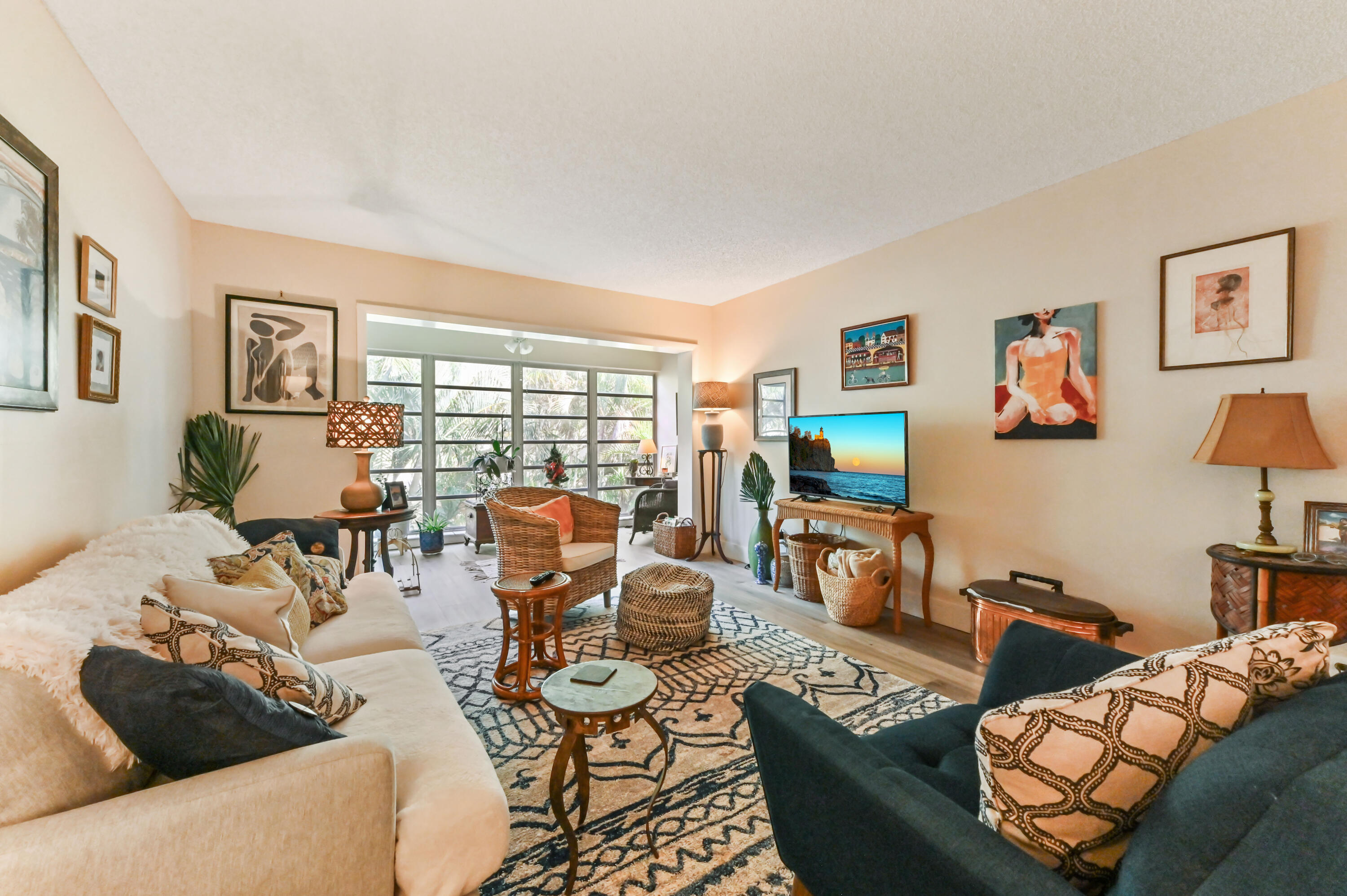 13960 Vía Flora, Unit H Delray Beach, FL 33484 - Photo 16 of 39 a living room with furniture and a flat screen tv
