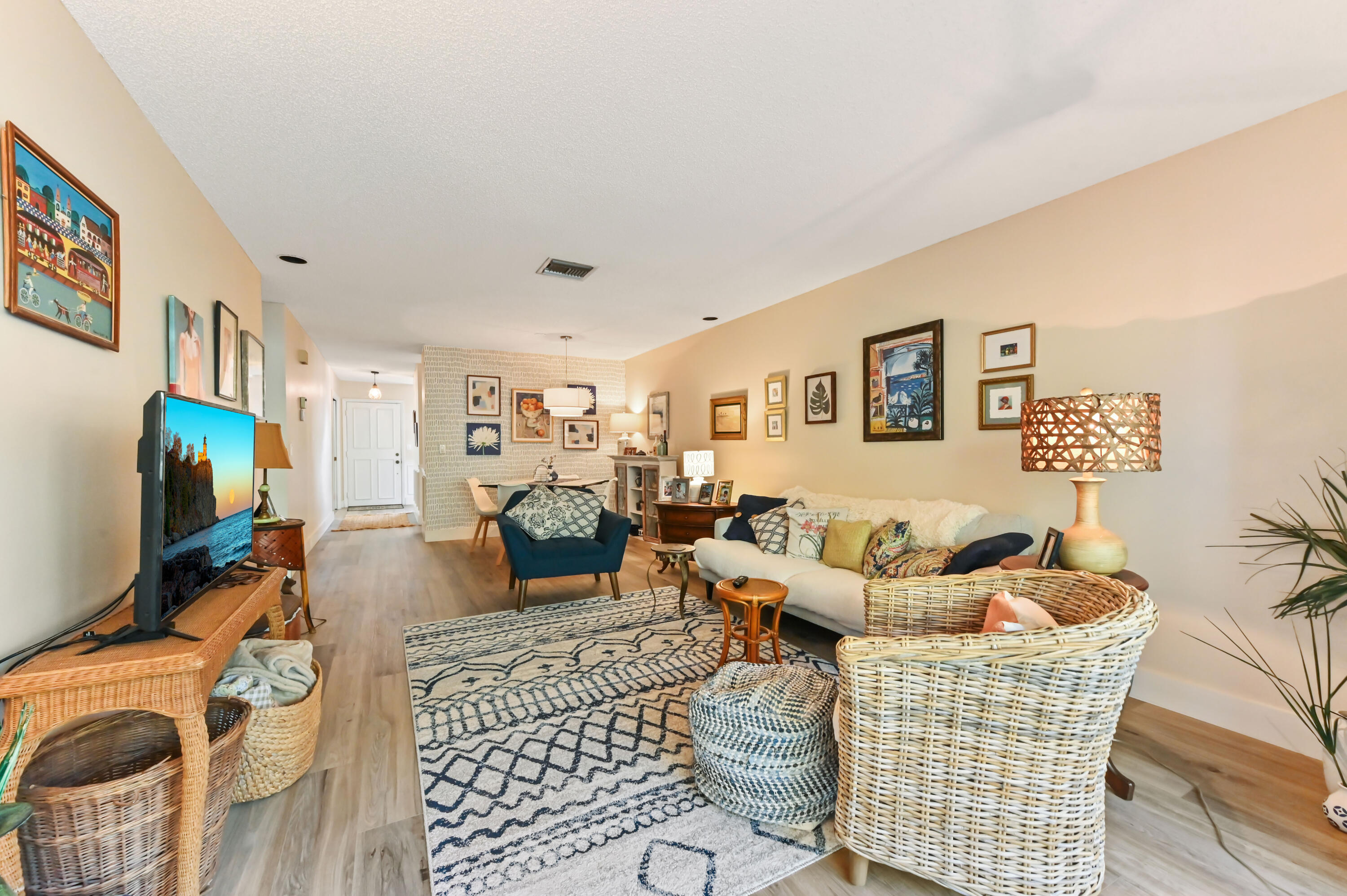 13960 Vía Flora, Unit H Delray Beach, FL 33484 - Photo 19 of 39 a living room with furniture and a flat screen tv