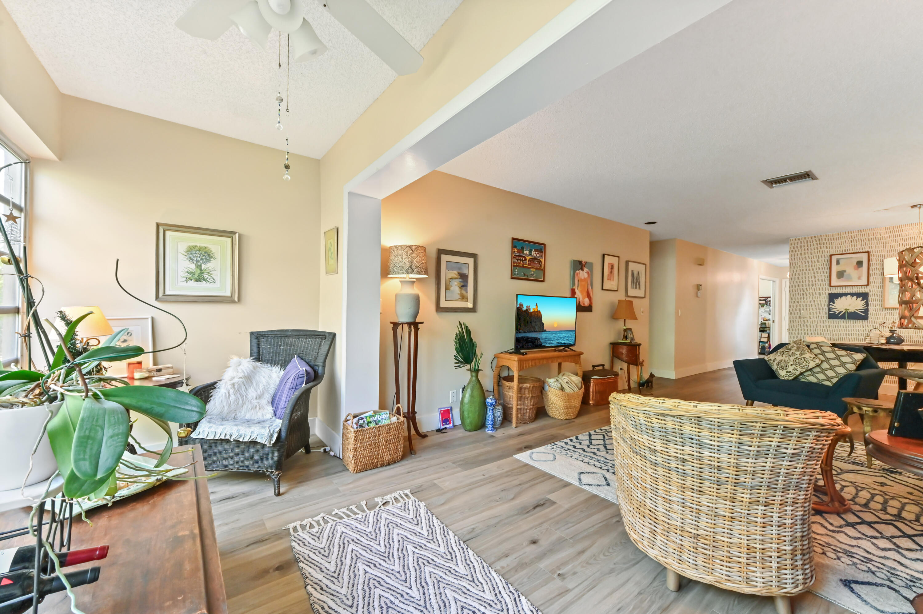 13960 Vía Flora, Unit H Delray Beach, FL 33484 - Photo 20 of 39 a living room with furniture and wooden floor