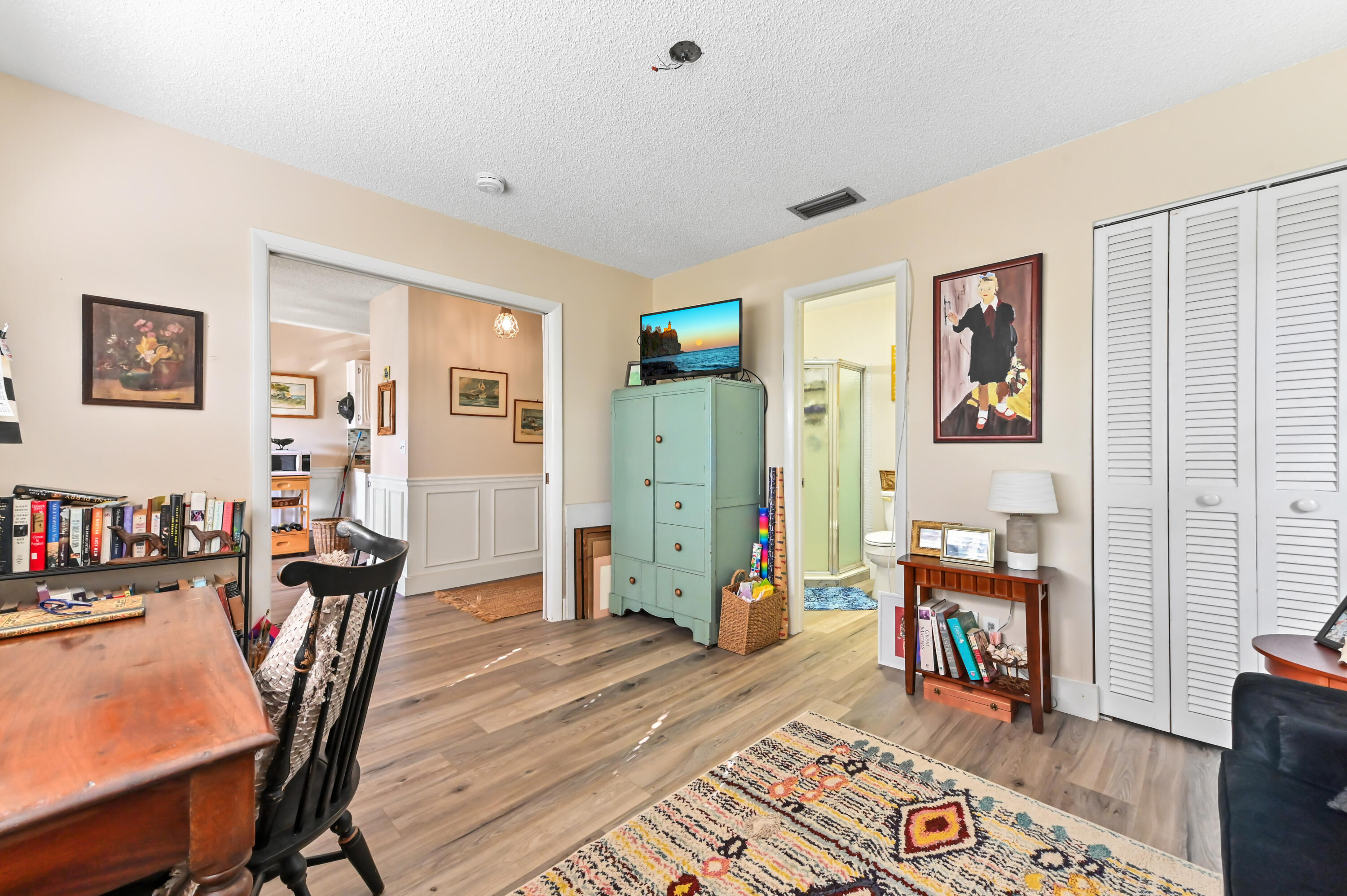 13960 Vía Flora, Unit H Delray Beach, FL 33484 - Photo 7 of 39 a work room with furniture and wooden floor