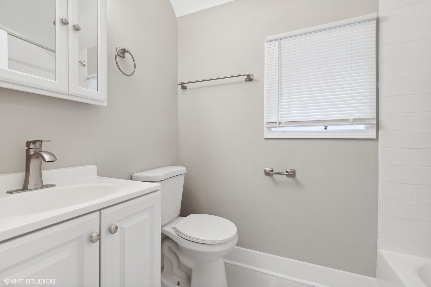 2490 Green Bay Road Highland Park, IL 60035 - Photo 21 of 29 a bathroom with a sink a toilet and a mirror