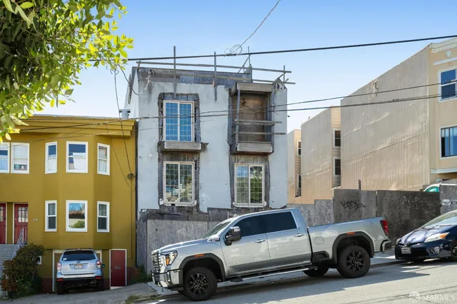 a car parked in front of a house