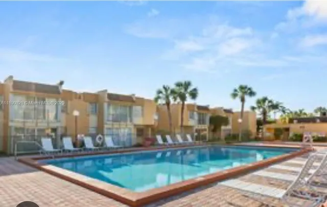 a view of swimming pool from a balcony
