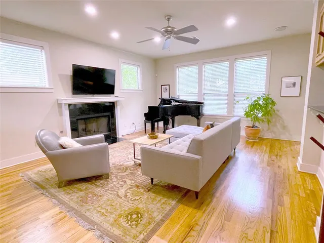 a living room with furniture fireplace and window