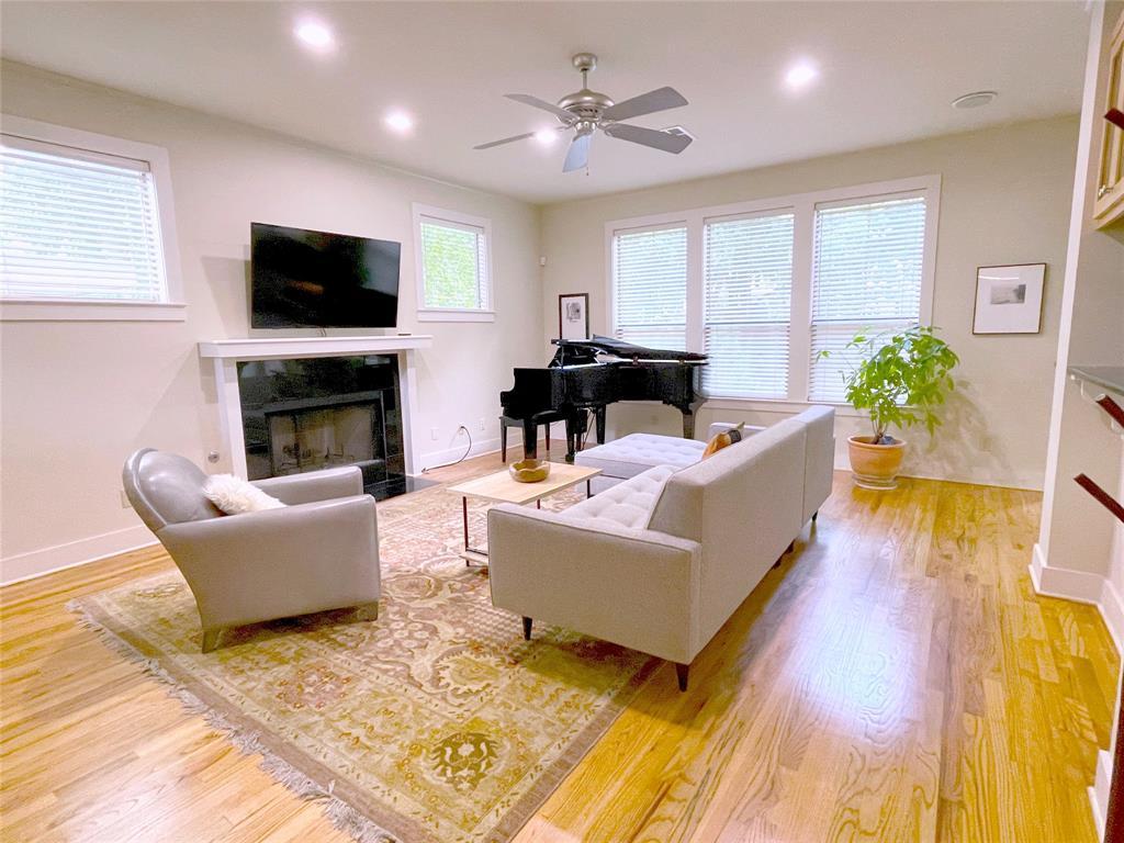 a living room with furniture fireplace and window