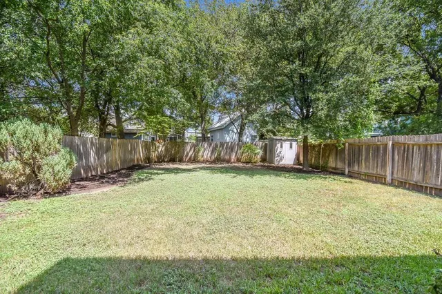 a view of a house with backyard and a slide