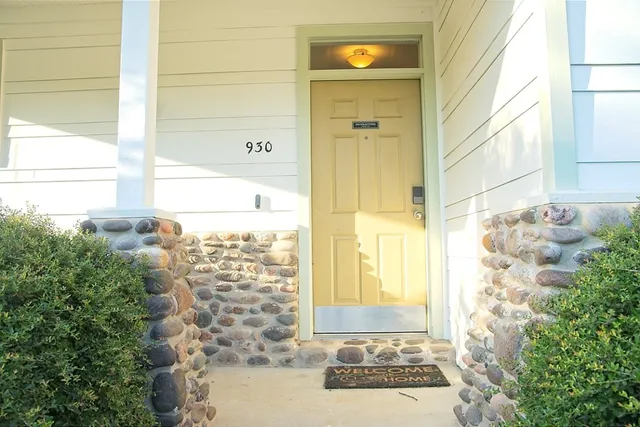 a view of a door and wooden floor