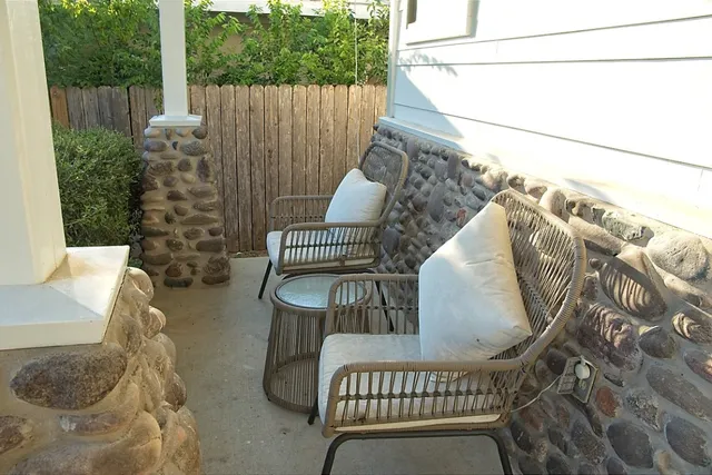 a view of balcony with furniture