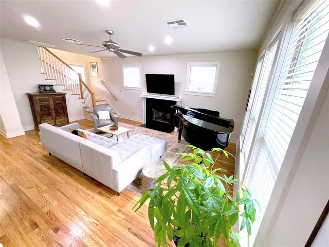 a living room with patio furniture and a flat screen tv