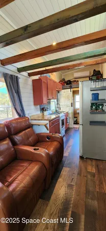 a living room with a couch and a dining table