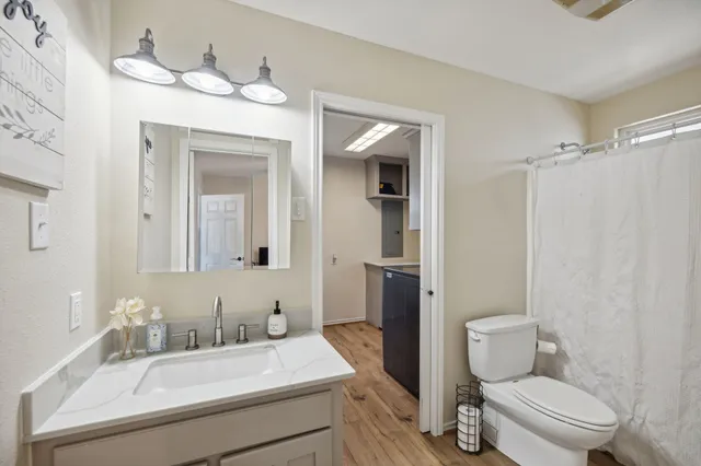a view of a livingroom with furniture and staircase