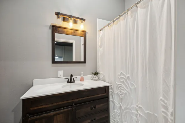 a balcony with furniture and wooden floor