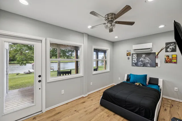 a bathroom with a sink a mirror and a shower