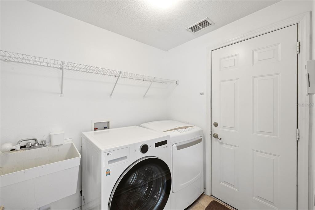 936 Kingsridge Circle Gotha, FL 34734 - Photo 25 of 50 a view of storage and utility room with washer and dryer