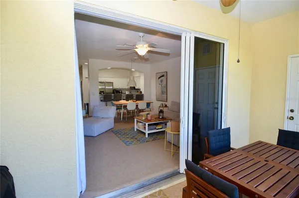 a view of a livingroom with furniture and a window