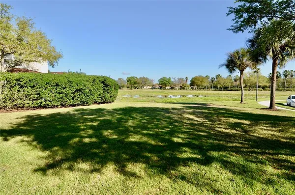 a view of a golf course with a lake