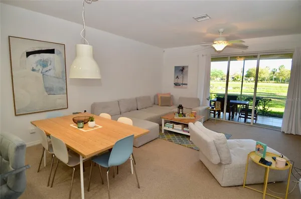 a living room with furniture and a large window